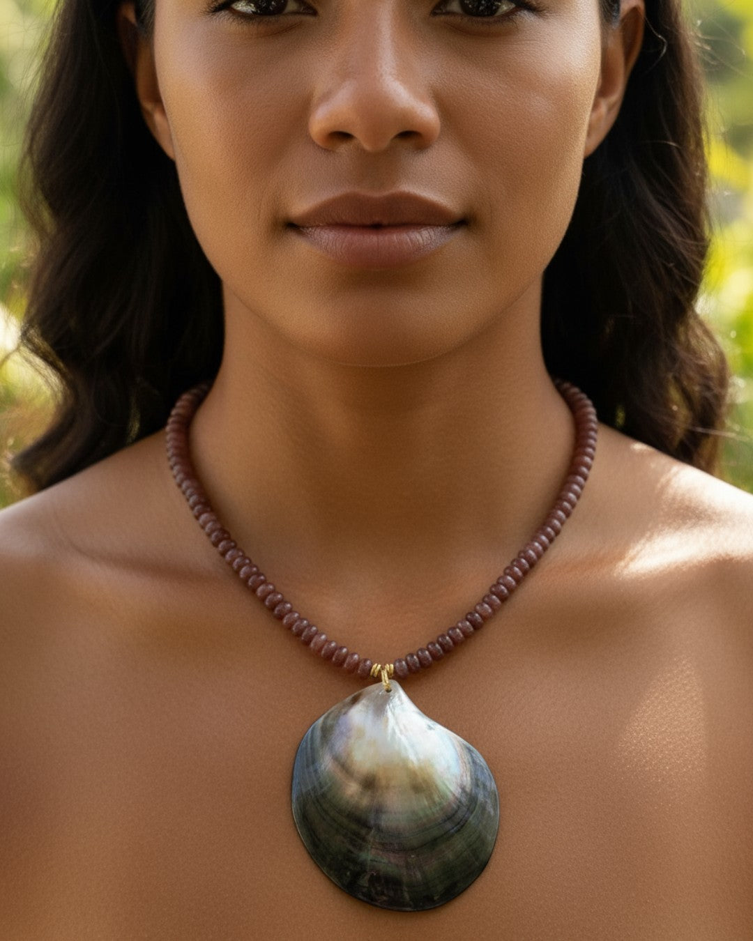 Woman wearing a necklace with a large pendant outdoors